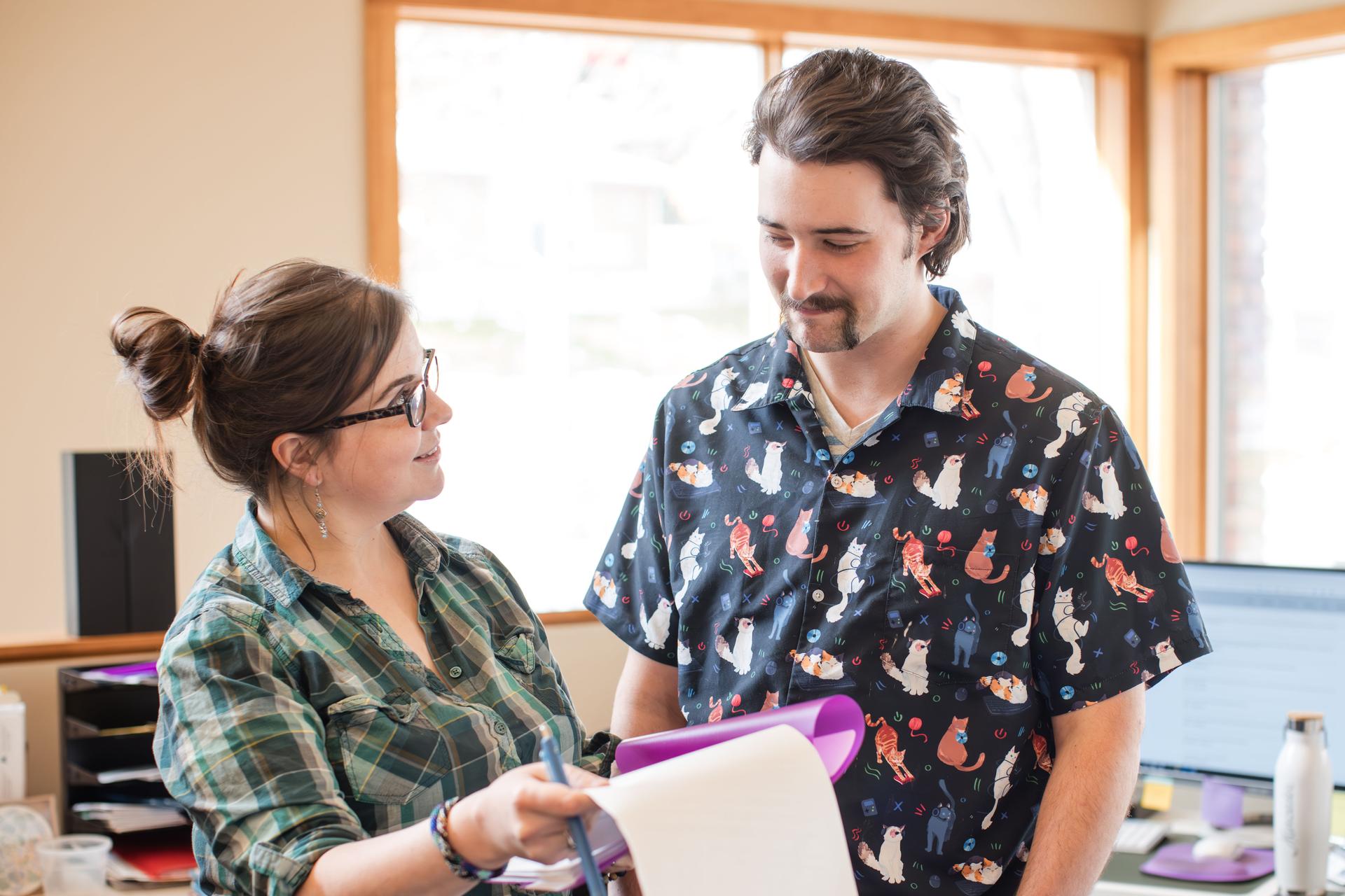 Montana Corporate staff member reviewing documents with a client