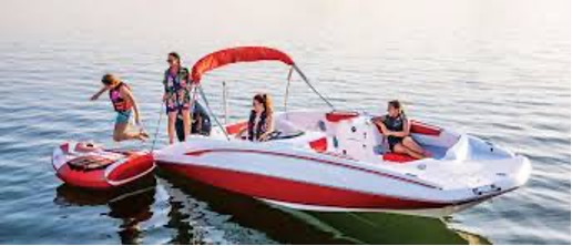 Family enjoying a day on a motorboat on the water